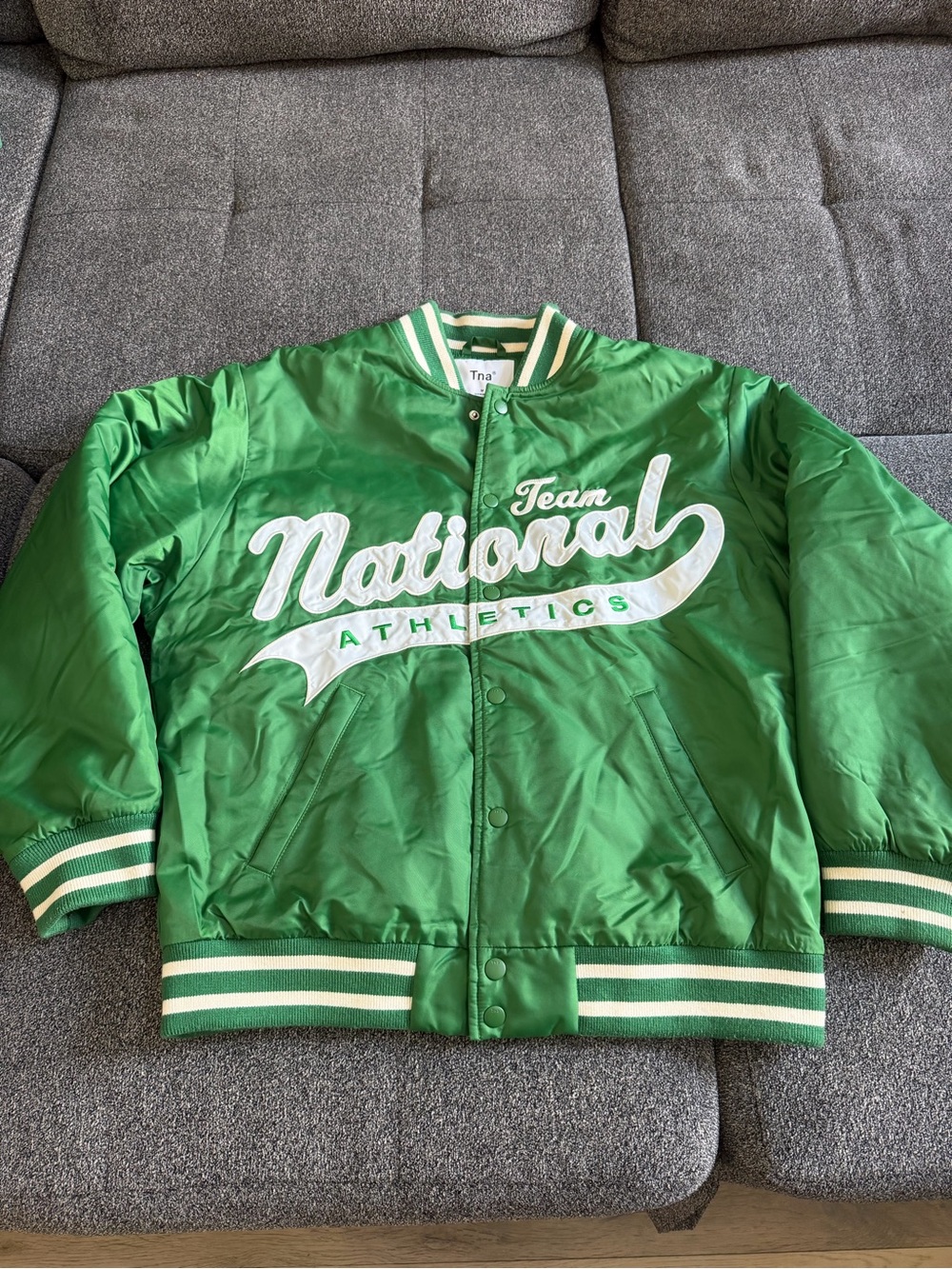 TNA Green Varsity-Style Puffer Jacket with White Script